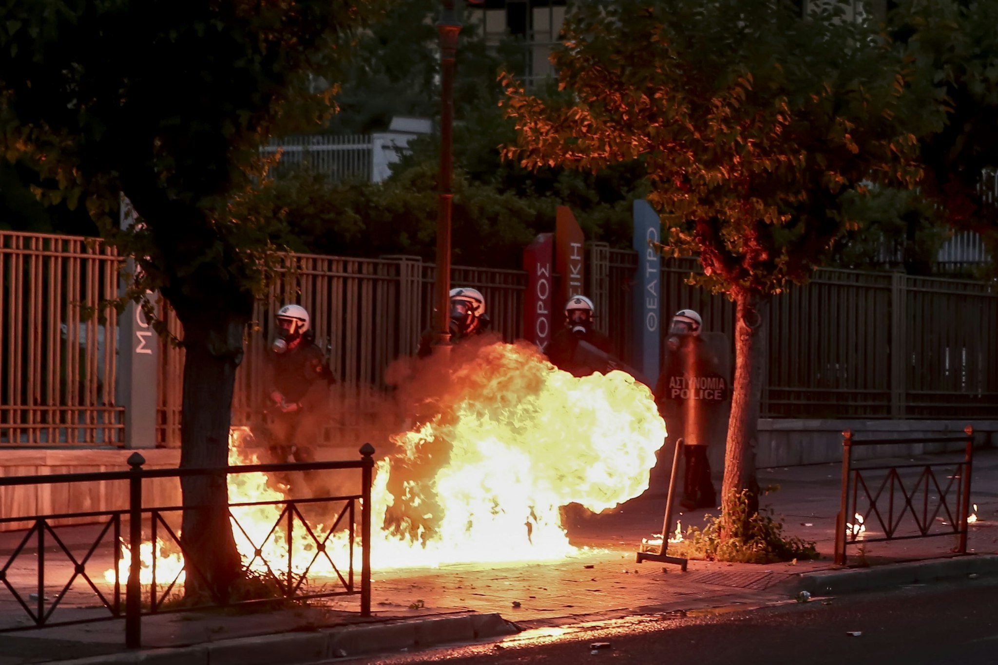 Riot police officers amid flames by petrol bombs thrown by protesters close to the U.S. embassy, during a demonstration over the death of George Floyd , in Athens, Greece on June 3, 2020. (Photo by Panayotis Tzamaros/NurPhoto via Getty Images)