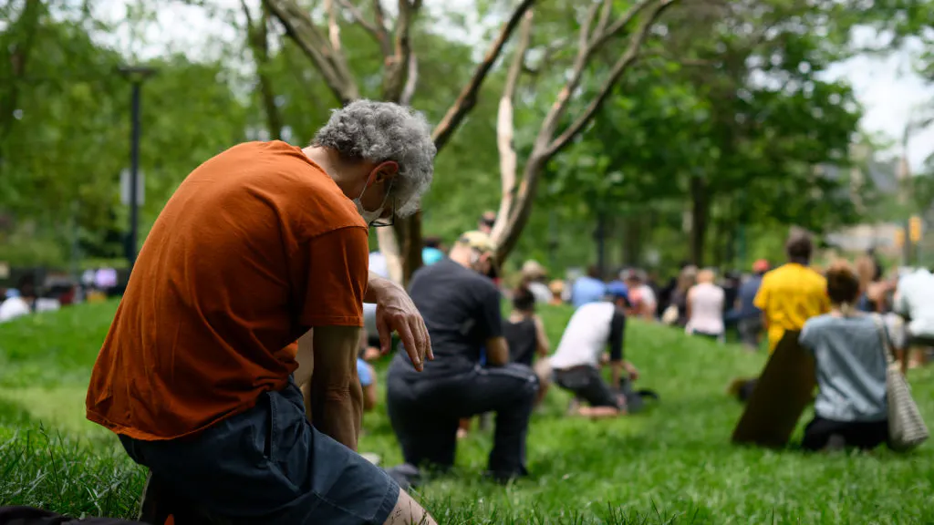 WATCH: White Cops, Civilians Wash Feet Of Black Organizers, Ask For Forgiveness