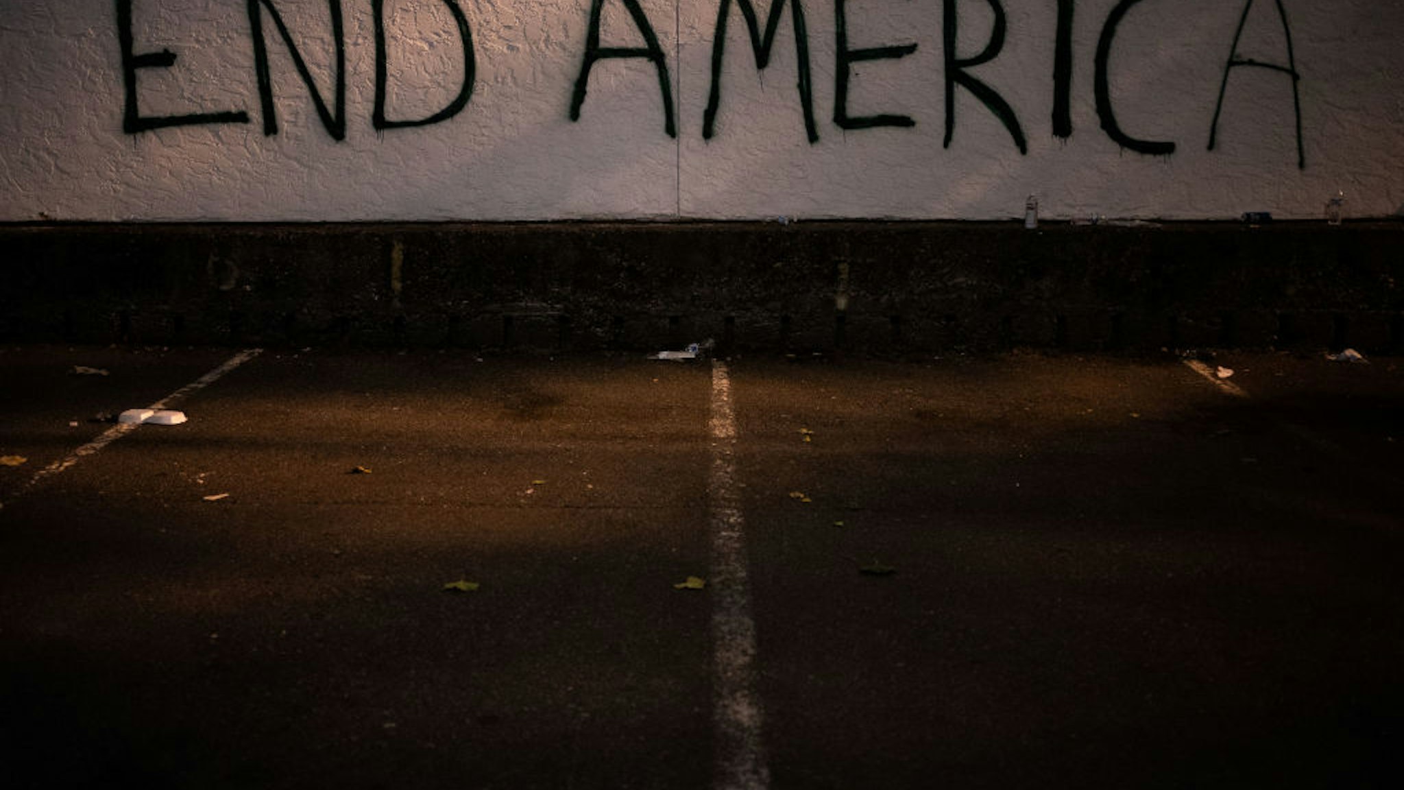 Graffiti is seen on a wall after demonstrators clashed with law enforcement near the Seattle Police Departments East Precinct shortly after midnight on June 8, 2020 in Seattle, Washington.