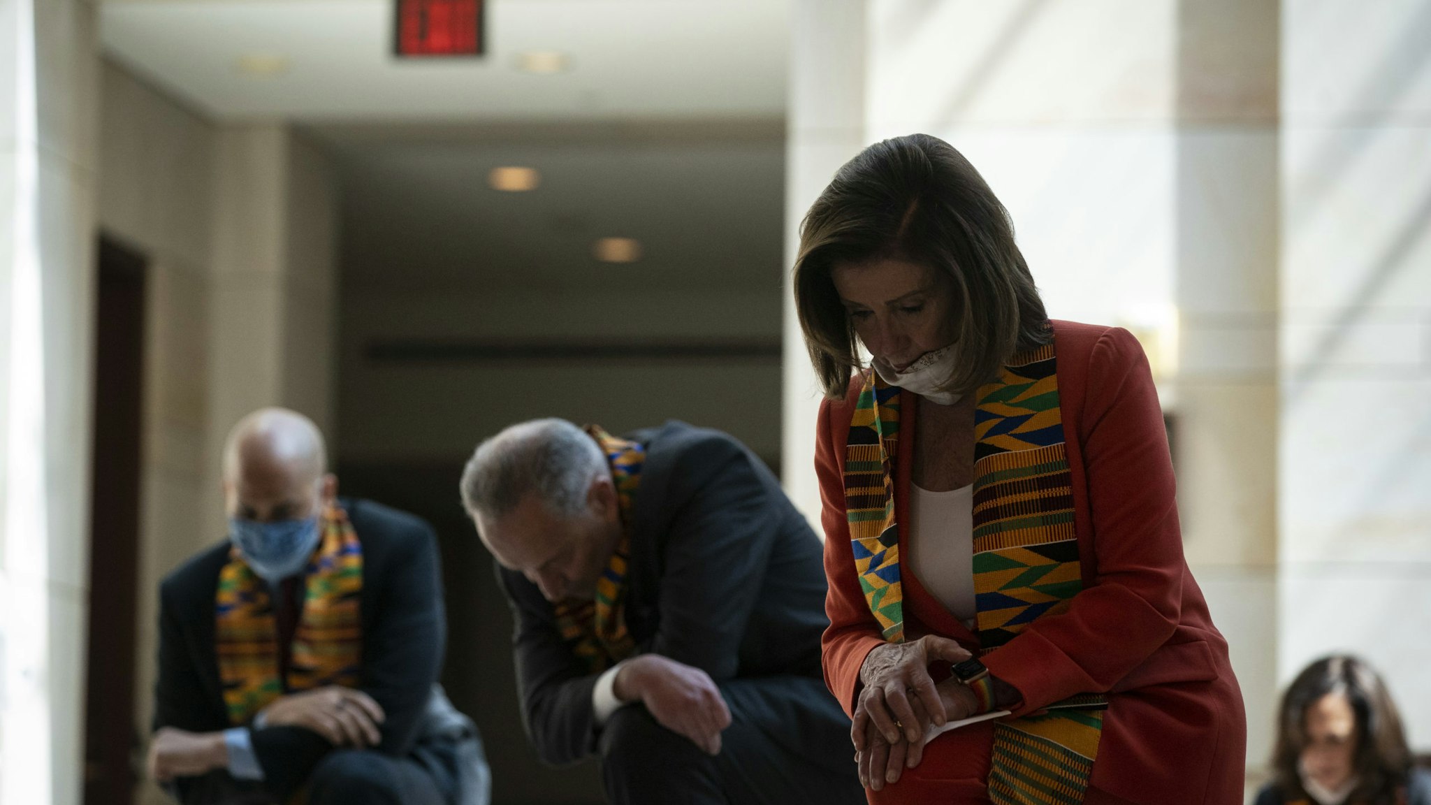 U.S. House Speaker Nancy Pelosi, a Democrat from California, and House and Senate Democrats bow their heads during a moment of silence in Emancipation Hall at the U.S. Capitol in Washington, D.C., U.S., on Monday, June 8, 2020. Democratic lawmakers plan to release a broad police overhaul bill today, hoping to turn the energy of the nationwide Black Lives Matter demonstrations into concrete legal changes that could make it easier to prosecute police abuse and misconduct, a Democratic aide said yesterday. Photographer: Al Drago/Bloomberg via Getty Images