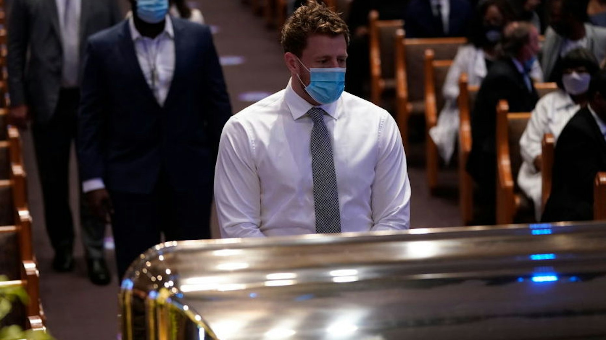 J.J. Watt of the NFL Houston Texans pauses at the casket bearing the remains of George Floyd in the chapel during his funeral service at the Fountain of Praise church June 9, 2020 in Houston, Texas.
