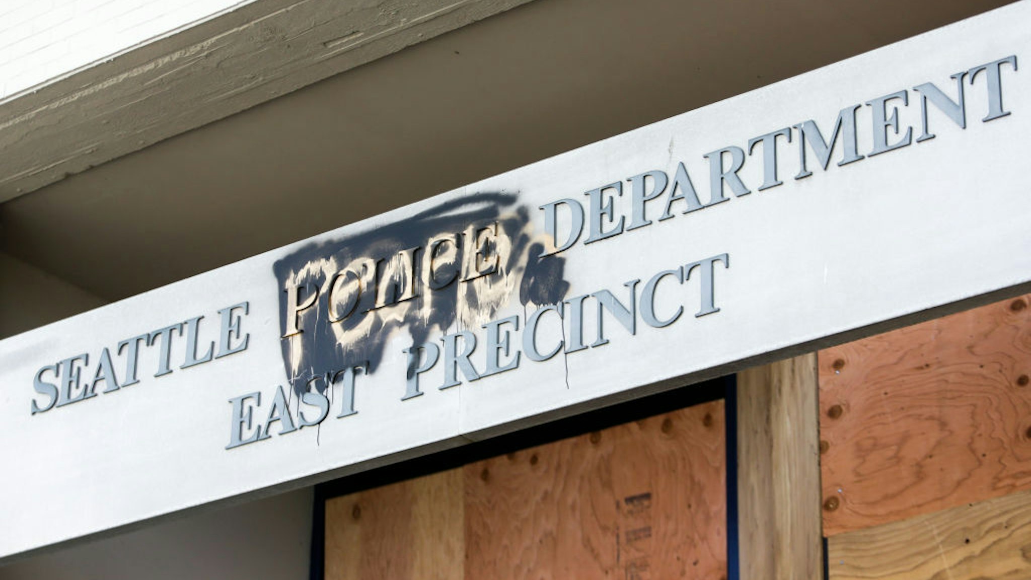 The word "people" is spray painted over the word "police" on the closed Seattle Police Department's East Precinct now surrounded by the area known as the Capitol Hill Autonomous Zone (CHAZ), in Seattle, Washington on June 11, 2020.