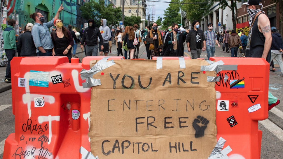 SEATTLE, WASHINGTON - JUNE 12: A sign inside the âCapitol Hill Autonomous Zoneâ in Seattle, Washington on June 12, 2020. The area named âAutonomous Zoneâ was formed after Seattle Police abandoned its East Precinct during protests against police brutality and the death of George Floyd, an unarmed black man who died after being pinned down by a white police officer in Minneapolis, Minnesota, United States on May 25, 2020. (Photo by Noah Riffe/Anadolu Agency via Getty Images)