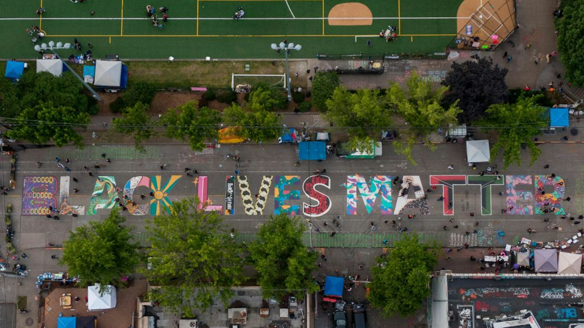 An aerial view of a Black Lives Matter mural on East Pine Street near Cal Anderson Park is seen during ongoing Black Lives Matter events in the so-called "CHOP," an area that protesters have called both the "Capitol Hill Occupied Protest" and the "Capitol Hill Organized Protest, on June 14, 2020 in Seattle, Washington.