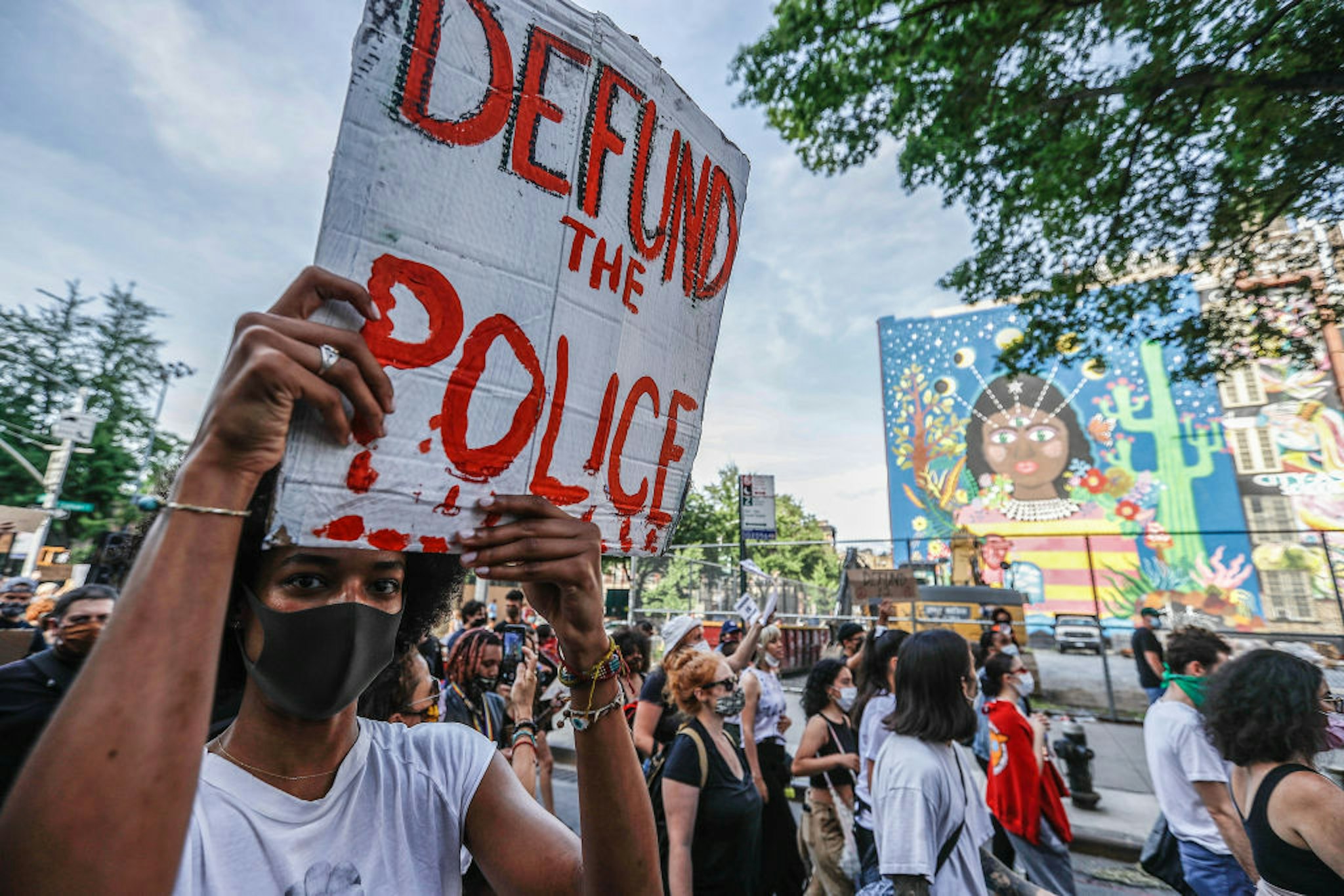 A demonstrator holds a placard during the protest. Protests continue against police brutality and racial injustice in New York City.