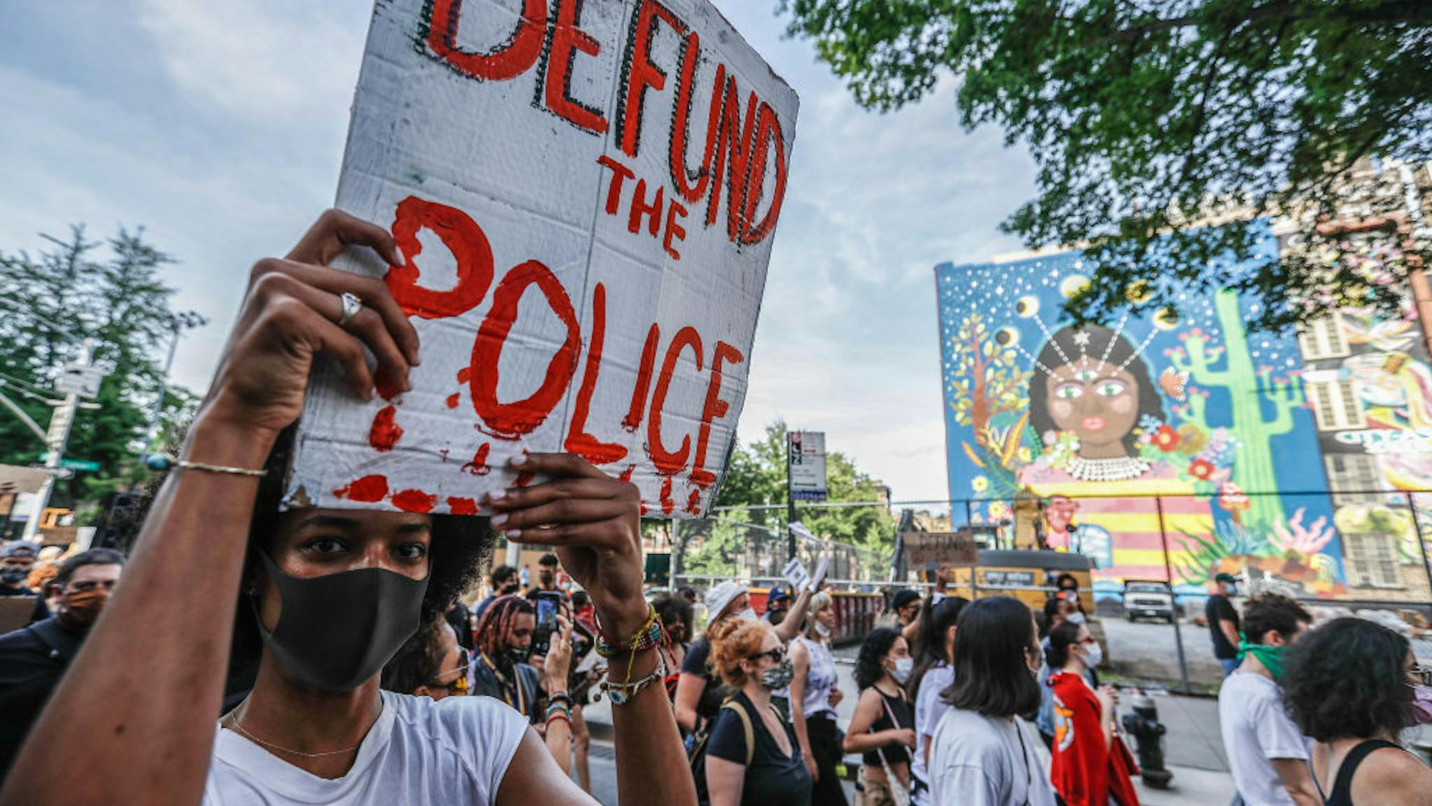 Protests A demonstrator holds a placard during the protest. Protests continue against police brutality and racial injustice in New York City.