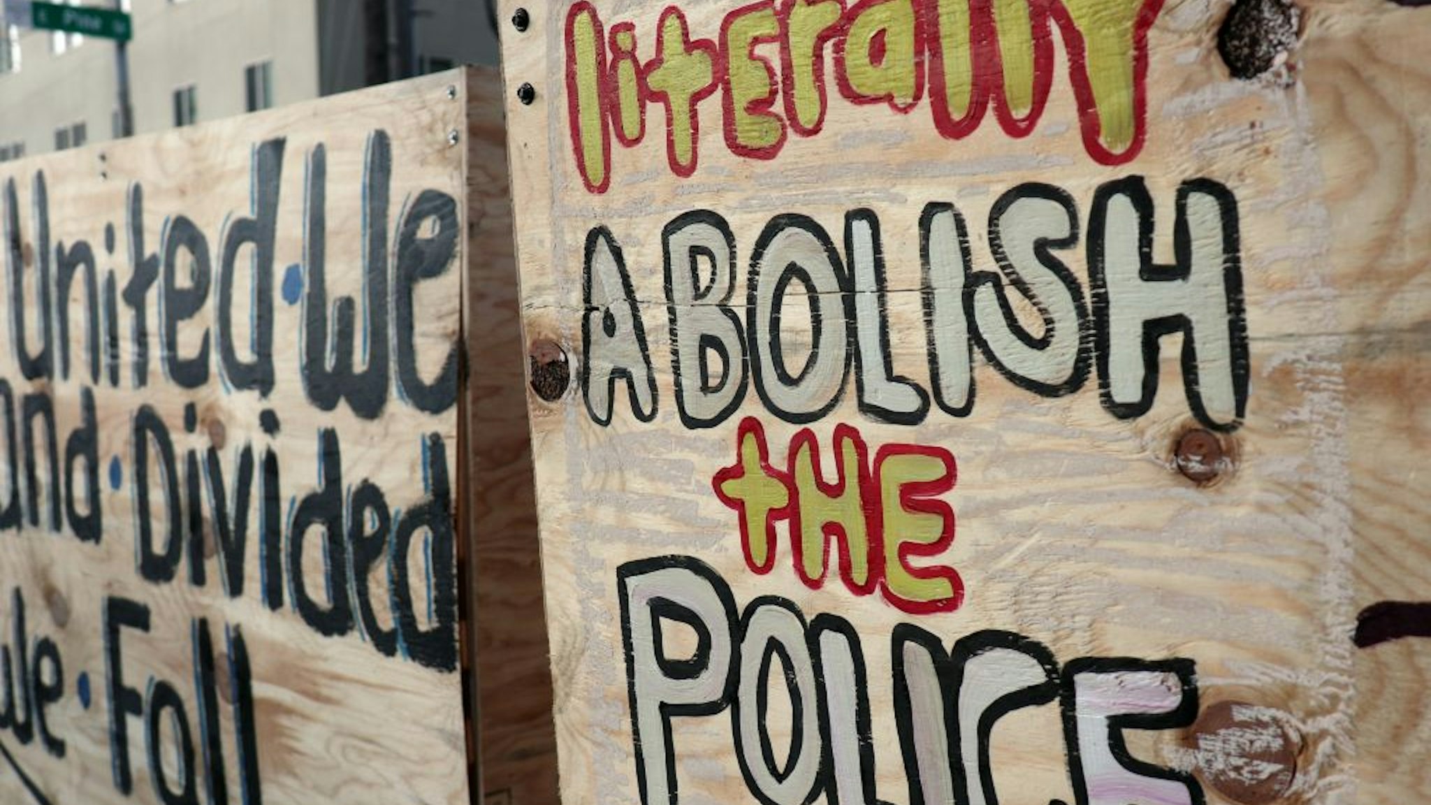Graffiti on a barricade inside the so-called "Capitol Hill Autonomous Zone" call for the abolition of police.