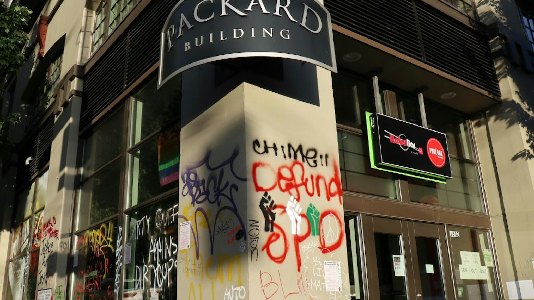 The Packard Building, an apartment building inside Seattle's so-called Capitol Hill Autonomous Zone, is seen being damaged and vandalized.