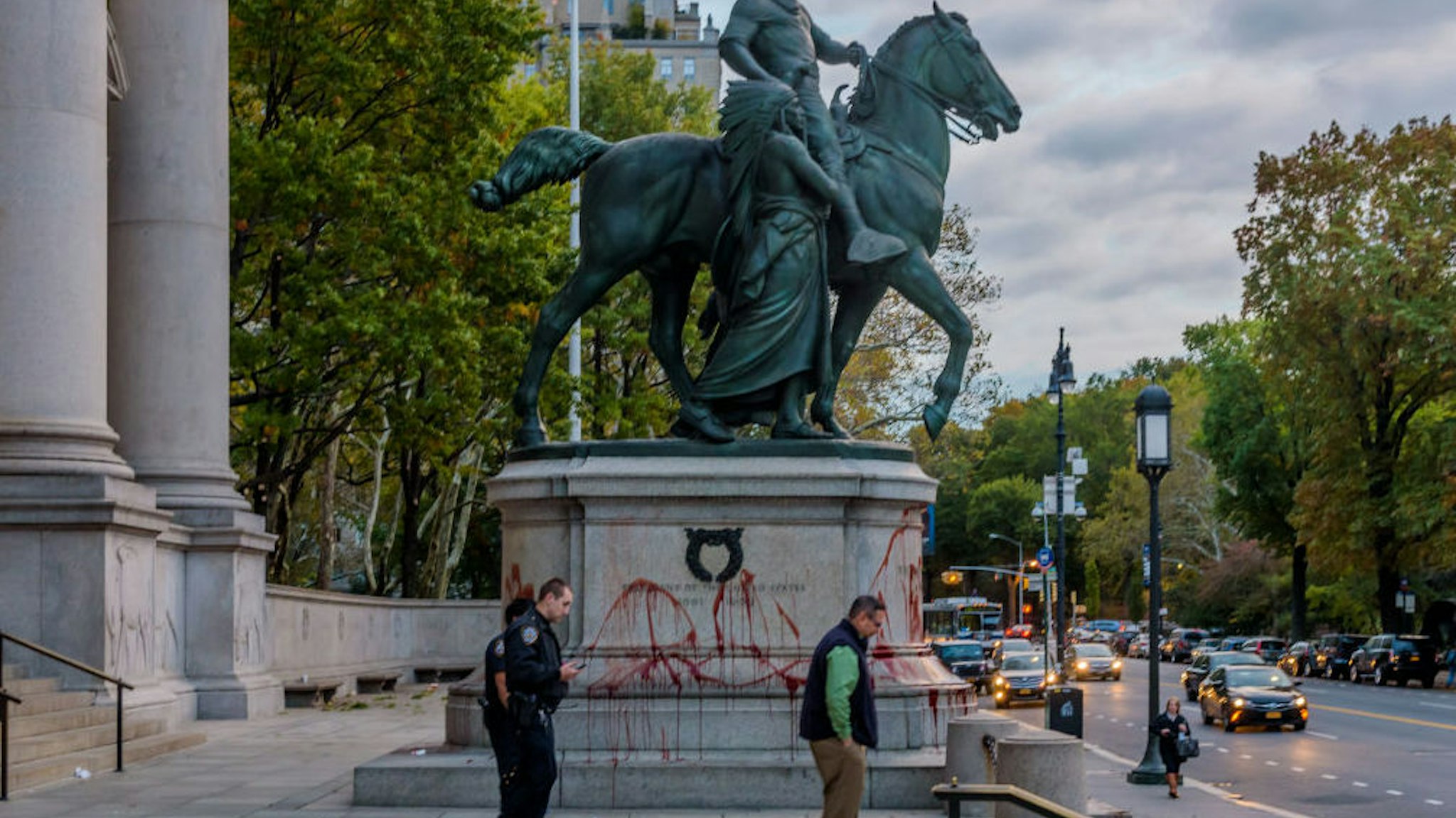 NYPD and museum security at the Roosevelt statue covered in "blood".