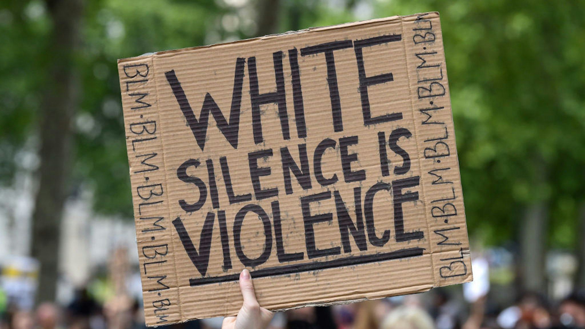 A Black Lives Matter protester holds a placard saying White Silence is Violence during the demonstration. Black Lives Matter protests continue in the United Kingdom after the death of George Floyd killed by a police officer in Minneapolis.