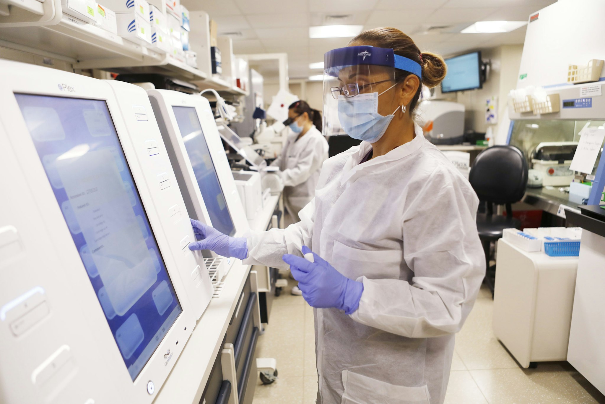 TAMPA, FL - JUNE 25: Adriana Cardenas, a medical technologist processes test samples for the coronavirus at the AdventHealth Tampa labs on June 25, 2020 in Tampa, Florida. Florida is currently experiencing a surge in COVID-19 cases, as the state reached a new record for single-day infections on Wednesday with 5,511 new cases. (Photo by Octavio Jones/Getty Images)