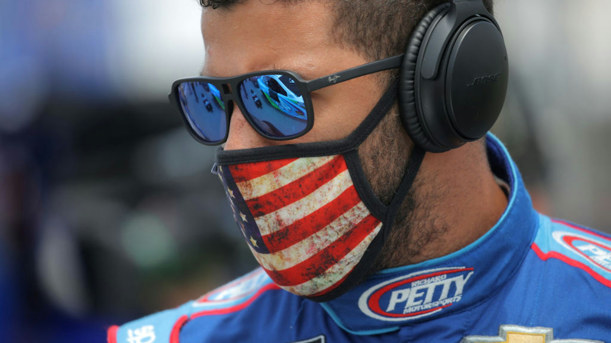 Bubba Wallace, driver of the #43 Victory Junction Chevrolet, stands on the grid prior to the NASCAR Cup Series GEICO 500 at Talladega Superspeedway on June 22, 2020 in Talladega, Alabama.