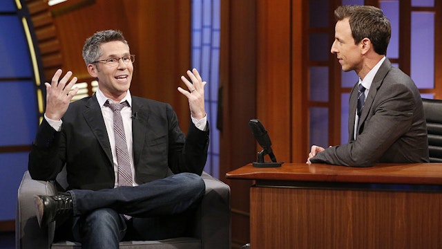Comedian John Henson during an interview with host Seth Meyers on July 16, 2014