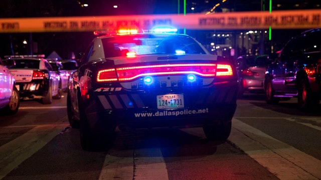 Police cars sit on Main Street in Dallas following the sniper shooting during a protest on July 7, 2016.