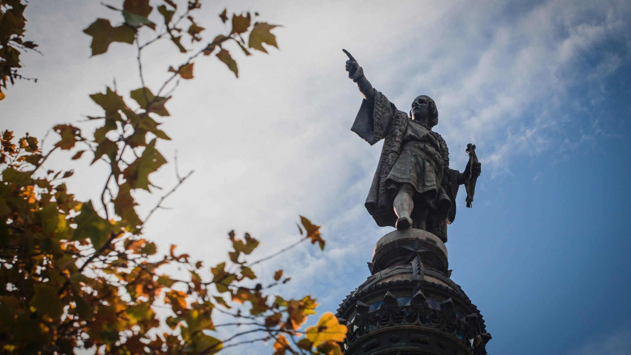 Monument Of Christopher Columbus Against Cloudy Sky - stock photo
