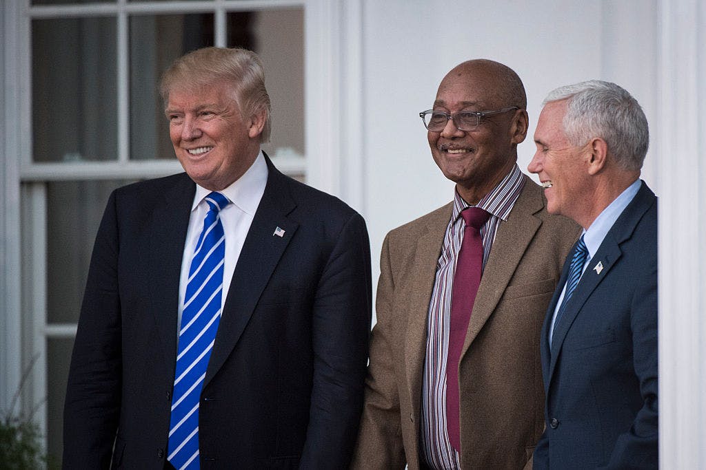 President-elect Donald Trump and Vice President-elect Mike Pence walk out with Center for Neighborhood Enterprises President Bob Woodson at the clubhouse at Trump National Golf Club Bedminster in Bedminster Township, N.J. on Saturday, Nov. 19, 2016.