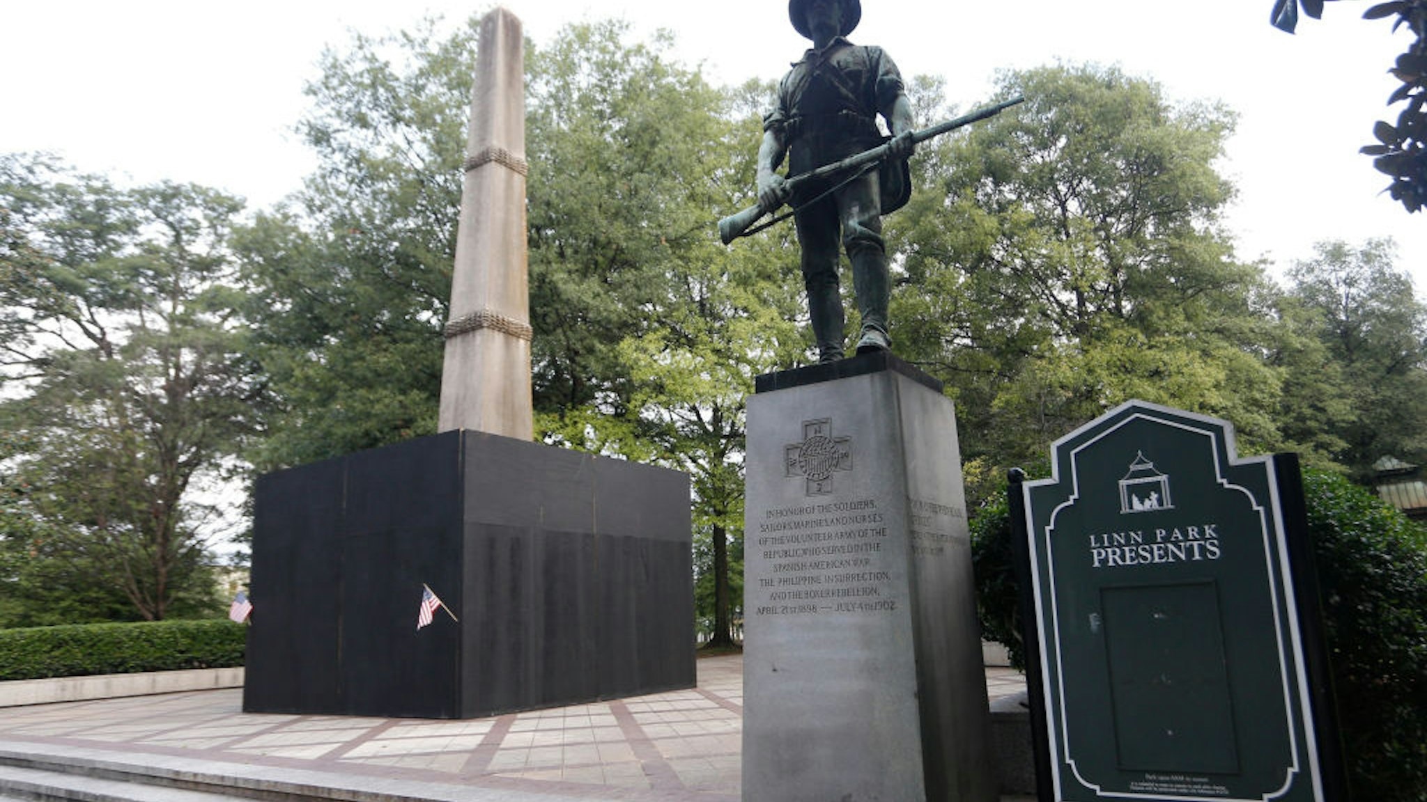 A monument to volunteers of the Army of the Republic stands next to a confederate monument covered up by the mayor of Birmingham in Linn Park August 18, 2017 in Birmingham, Alabama.