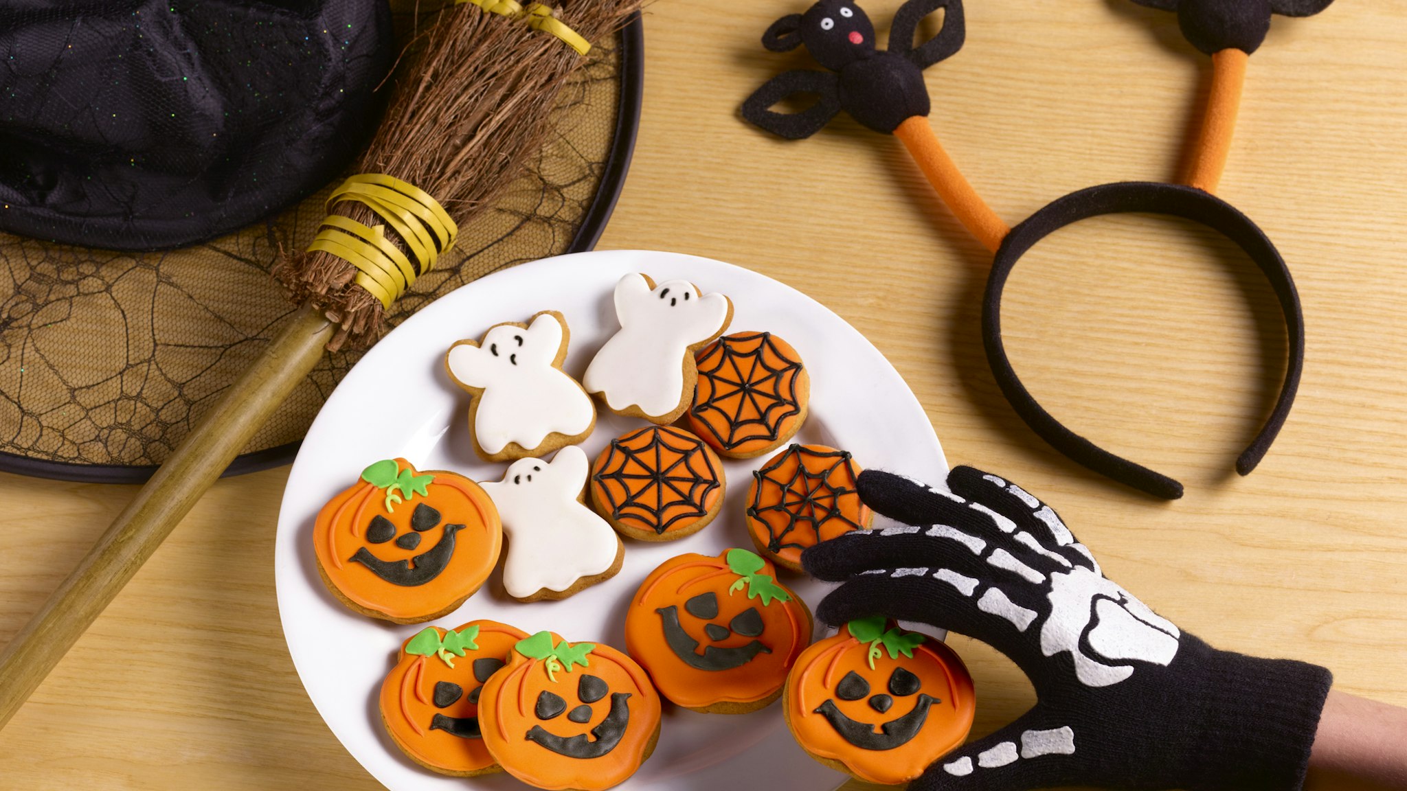 Halloween party with witches costume and cookies - stock photo