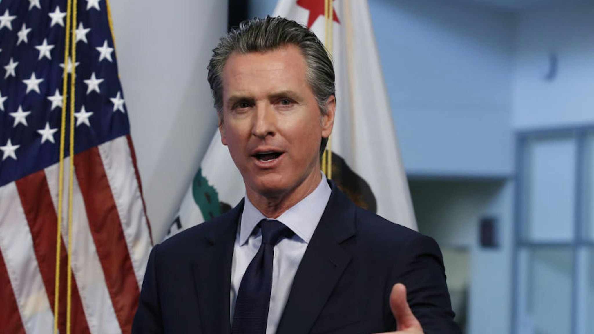 Gavin Newsom, governor of California, speaks during a news conference in Sacramento, California, U.S., on Tuesday, April 14, 2020. Newsom outlined his plan to lift restrictions in the most-populous U.S. state, saying a reopening depends on meeting a series of benchmarks that would remake daily life for 40 million residents.