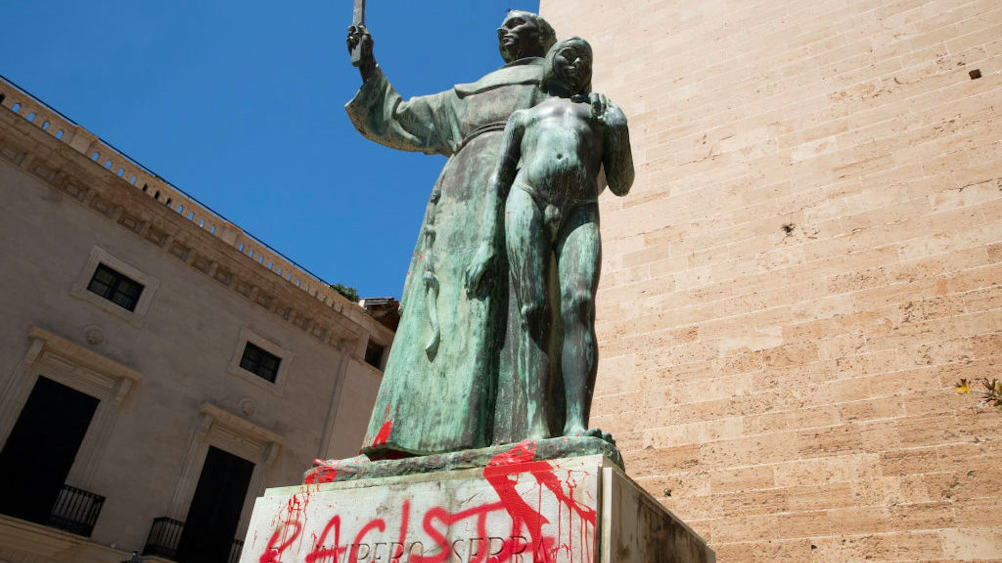 The statue of the Roman Catholic Spanish priest Junipero Serra is pictured in Palma de Mallorca on June 22, 2020, after it was daubed with graffiti reading "Racist". - The protests against racial inequality and police brutality have seen the toppling or removal of statues depicting Confederate generals, colonial figures and slave traders in the United States, Britain and New Zealand. (Photo by JAIME REINA / AFP) (Photo by JAIME REINA/AFP via Getty Images)