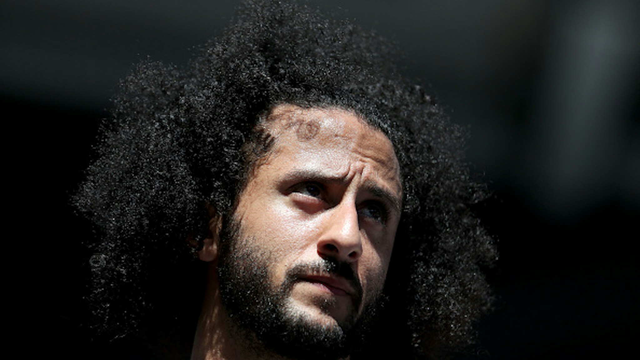 NEW YORK, NEW YORK - AUGUST 29: Former San Francisco 49er Colin Kaepernick watches a Women's Singles second round match between Naomi Osaka of Japan and Magda Linette of Poland on day four of the 2019 US Open at the USTA Billie Jean King National Tennis Center on August 29, 2019 in Queens borough of New York City.