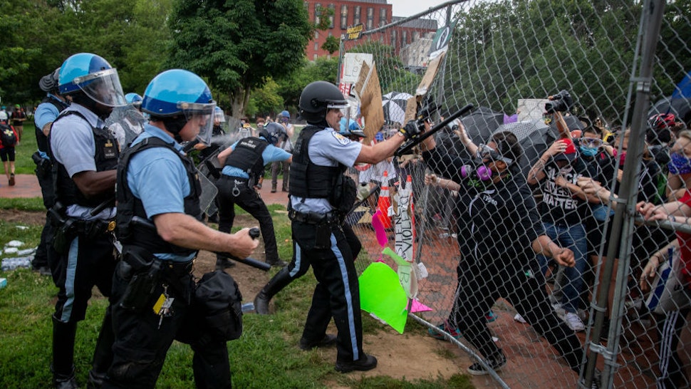 Protesters clash with U.S. Park Police after protesters attempted to pull down the statue of Andrew Jackson in Lafayette Square near the White House on June 22, 2020 in Washington, DC. Protests continue around the country over the deaths of African Americans while in police custody. (Photo by Tasos Katopodis /Getty Images)