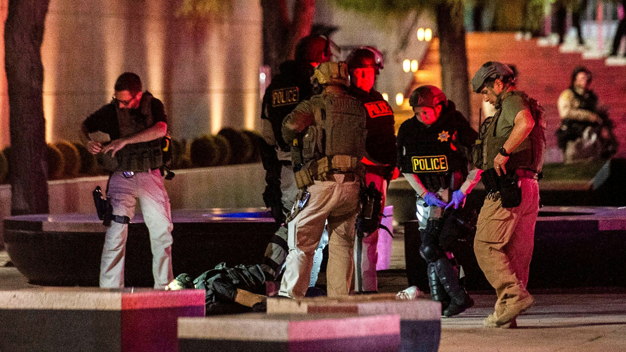 Police officers surround a person that was shot near the 300 block of South Las Vegas Boulevard, on June 1, 2020, in downtown Las Vegas, at the end of a rally in response to the recent death of George Floyd, an unarmed black man who died while in police custody. - Thousands of National Guard troops patrolled major US cities after five consecutive nights of protests over racism and police brutality that boiled over into arson and looting, sending shock waves through the country. The death Monday of an unarmed black man, George Floyd, at the hands of police in Minneapolis ignited this latest wave of outrage in the US over law enforcement's repeated use of lethal force against African Americans -- this one like others before captured on cellphone video.