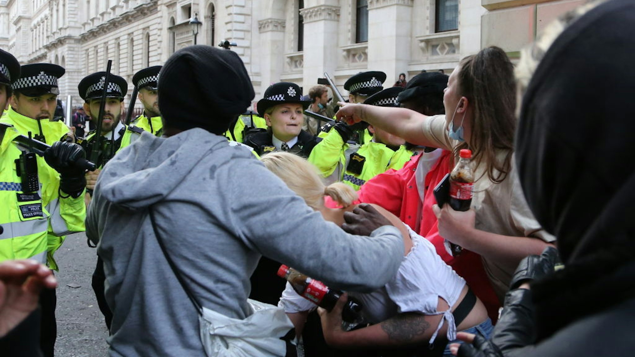 Police officers intervene in demonstrators during a protest in solidarity with U.S. anti-racism demonstrations after George Floyd's death, outside Downing Street in London, United Kingdom on June 07, 2020. (Photo by Ilyas Tayfun Salci/Anadolu Agency via Getty Images)
