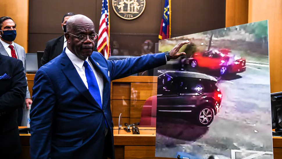 Fulton County District Attorney Paul L. Howard Jr. point at a picture displayed inside the courtroom as he announces 11 charges against former Atlanta Police Officer Garrett Rolfe on June 17, 2020, in Atlanta, Georgia. - An Atlanta police officer will be charged with murder for shooting a 27-year-old man in the back, justice officials announced June 17 in the latest case to spark anger over police killings of African Americans.