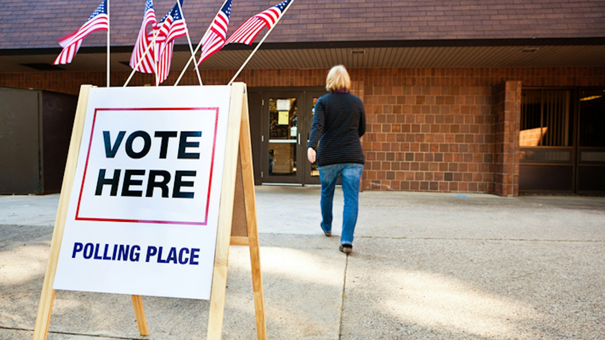 Woman entering polling place.