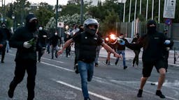Rioters Protesters hurl petrol bombs to riot police officers during a demonstration at the U.S. embassy over the death of George Floyd , in Athens, Greece on June 3, 2020. (Photo by Panayotis Tzamaros/NurPhoto)