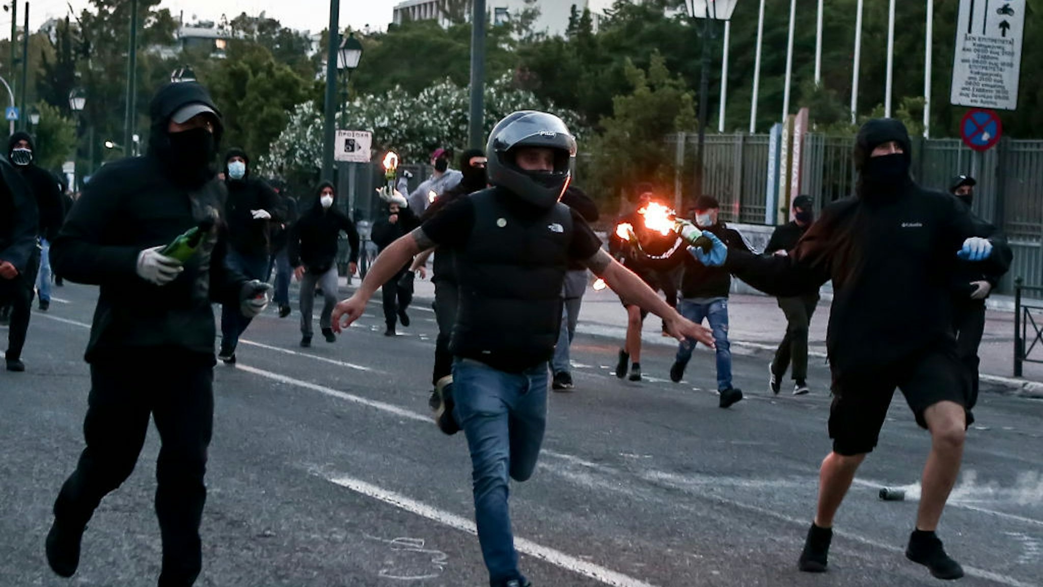 Protesters hurl petrol bombs to riot police officers during a demonstration at the U.S. embassy over the death of George Floyd , in Athens, Greece on June 3, 2020. (Photo by Panayotis Tzamaros/NurPhoto)