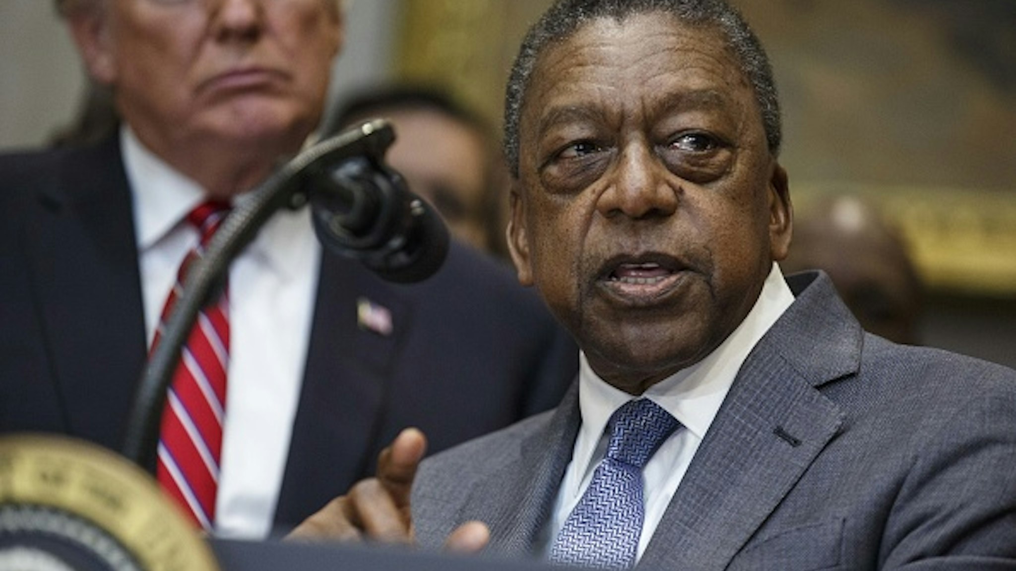 Robert Johnson, founder of Rlj Cos. and co-founder of Black Entertainment Television (BET), speaks during an executive order signing in the Roosevelt Room of the White House in Washington, D.C., U.S., on Wednesday, Dec. 12, 2018. President Donald Trump signed an order to create a White House Opportunity and Revitalization Council, directing federal agencies to steer spending toward certain distressed communities across the country called opportunity zone.