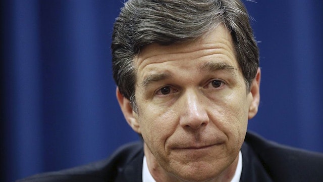 North Carolina Attorney General Roy Cooper, a Democrat, has condemned his state's Republican-sponsored voter ID law and constitutional amendment to ban same-sex marriage. But in his position he must defend the state against lawsuits on both issues. (Raleigh News & Observer/Tribune News Service via Getty Images)