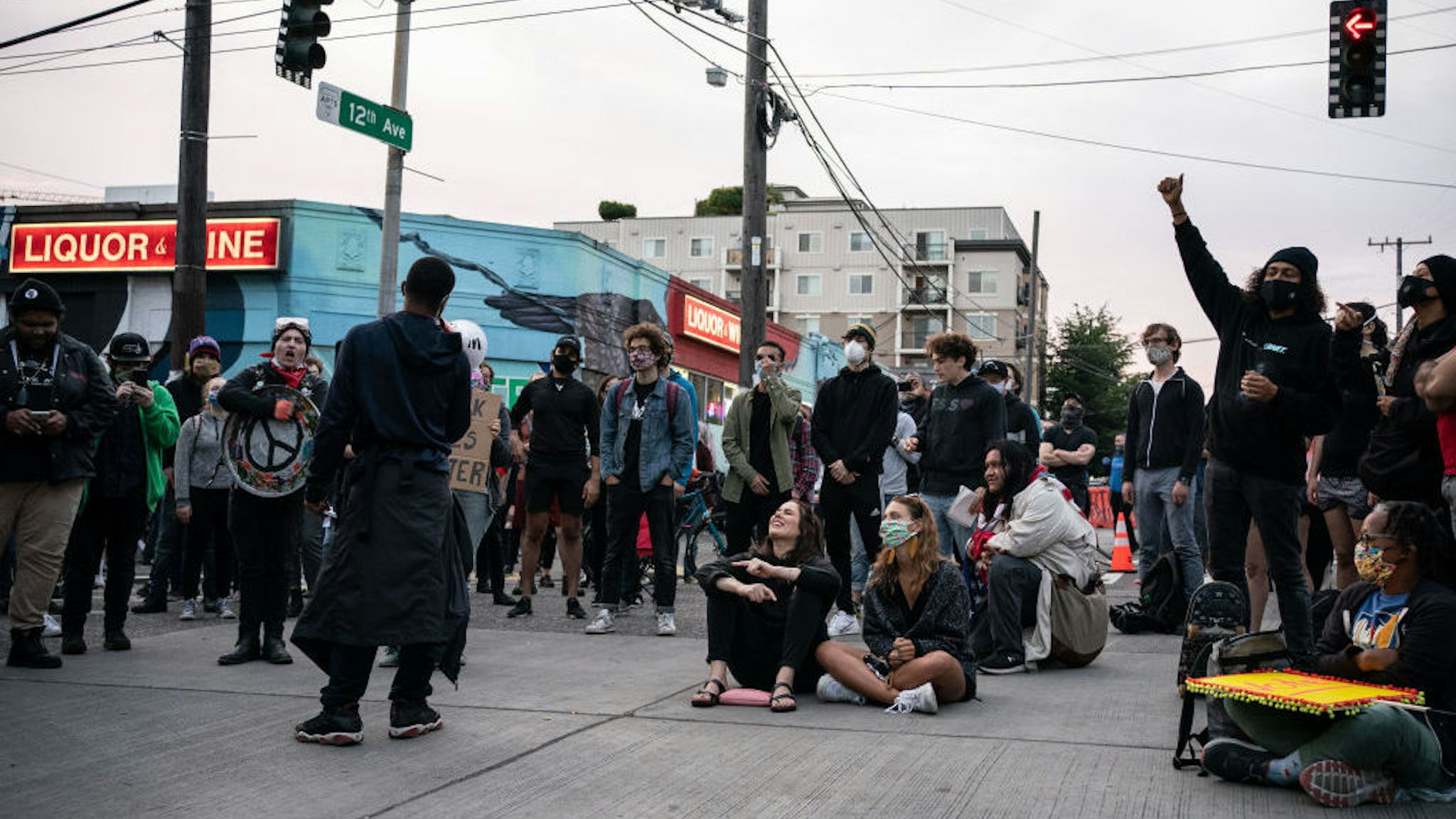 People rally in front of the Seattle Police Departments East Precinct in the so-called "Capitol Hill Autonomous Zone" on June 10, 2020 in Seattle, Washington. The zone includes the blocks surrounding the Seattle Police Departments East Precinct, which was the site of violent clashes with Black Lives Matter protesters, who have continued to demonstrate in the wake of George Floyds death. (Photo by David Ryder/Getty Images)