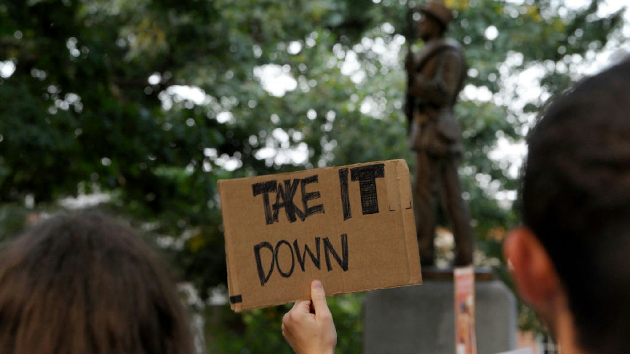 Demonstrators rally for the removal of a Confederate statue coined Silent Sam on the campus of the University of Chapel Hill on August 22, 2017 in Chapel Hill North Carolina. (Photo by Sara D. Davis/Getty Images)