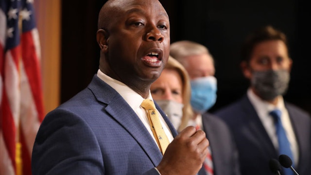 WASHINGTON, DC - JUNE 17: Sen. Tim Scott (R-SC) is joined by fellow Republican lawmakers for a news conference to unveil the GOP's legislation to address racial disparities in law enforcement at the U.S. Capitol June 17, 2020 in Washington, DC. Scott, the Senate's lone black Republican, lead the effort to write the Just and Unifying Solutions to Invigorate Communities Everywhere (JUSTICE) Act, which discourages the use of chokeholds, requires police departments to release more information on use of force and no-knock warrants, and encourages body cameras and better training.