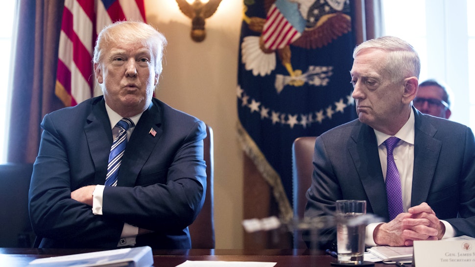 WASHINGTON, DC - MARCH 8: (AFP OUT) US President Donald J. Trump (L) speaks beside US Secretary of Defense Jim Mattis (R) during a meeting with members of his Cabinet, in the Cabinet Room of the White House March 8, 2018 in Washington, DC