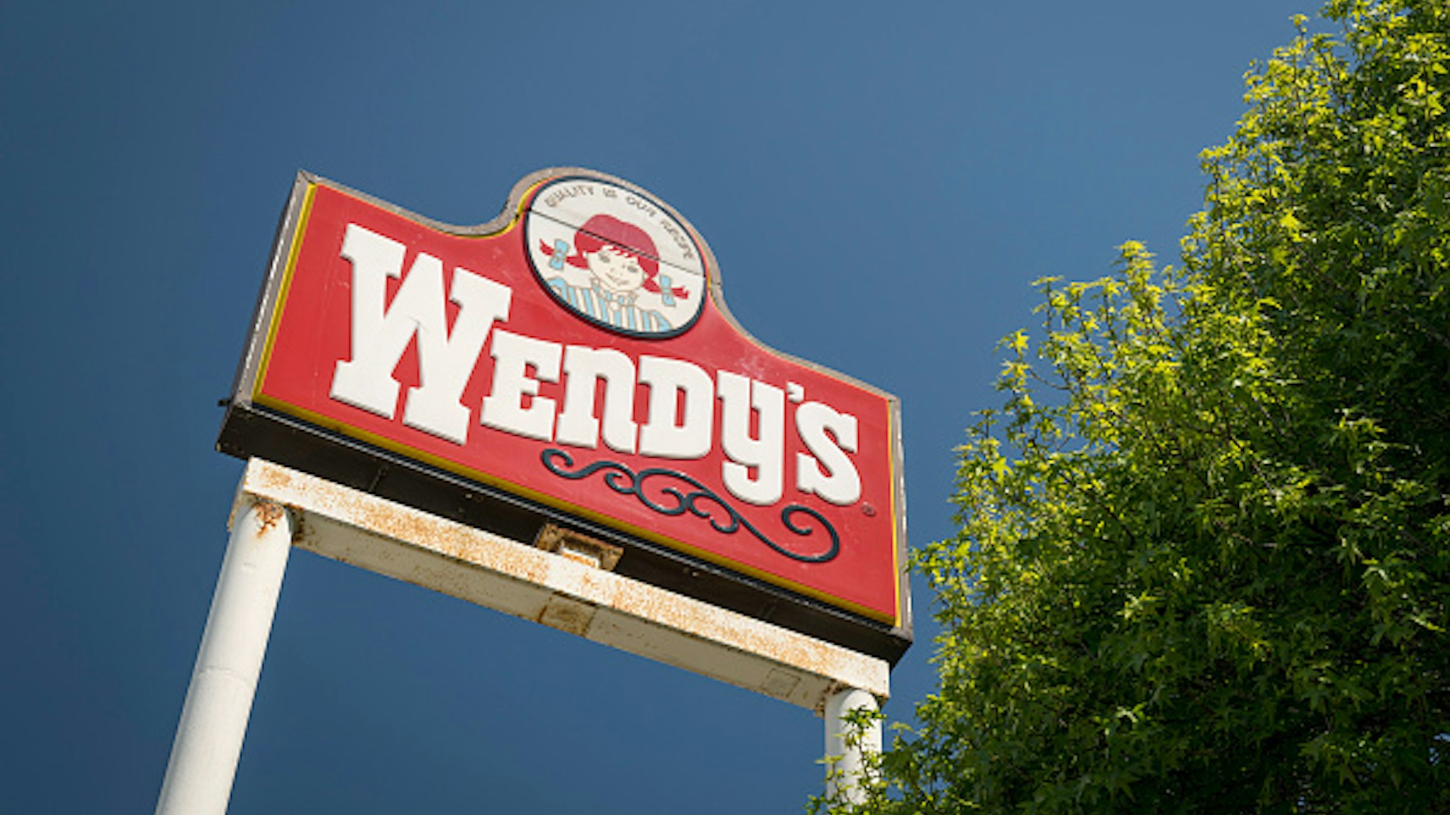 Signage is displayed at a Wendys Co. restaurant in Richmond, California, U.S., on Wednesday, May 6, 2020. Fast-food chain Wendys Co. jumped the most in a month after reporting that the sales slump caused by the Covid-19 pandemic is easing.