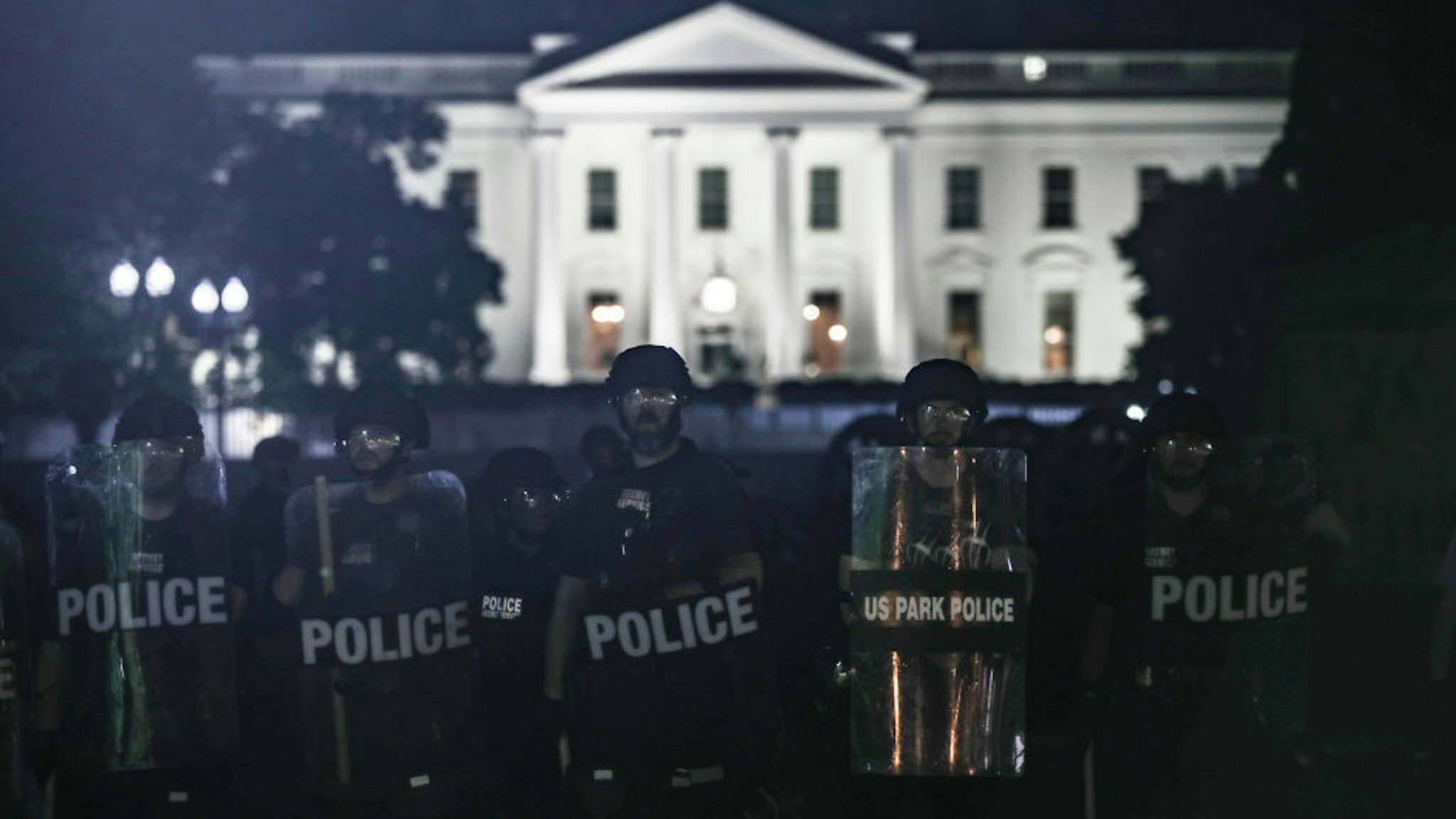 Police take security measures near White House during a protest over the death of George Floyd, an unarmed black man who died after being pinned down by a white police officer in Washington, United States on June 1, 2020. (Photo by Yasin Ozturk/Anadolu Agency via Getty Images)