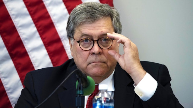 William Barr, U.S. attorney general, adjusts his glasses during a roundtable discussion with law enforcement in Wichita, Kansas, U.S., on Wednesday, Oct. 2, 2019. Barr, Secretary of State Michael Pompeo, and President Donald Trump's personal lawyer Rudy Giuliani have all been drawn into a House impeachment inquiry after details of the administration's foreign contacts emerged.