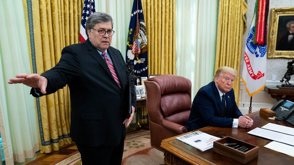 President Donald Trump with Attorney General William Barr, make remarks before signsing an executive order in the Oval Office that will punish Facebook, Google and Twitter for the way they police content online, Thursday, May 28, 2020. ( Photo by Doug Mills/The New York Times)