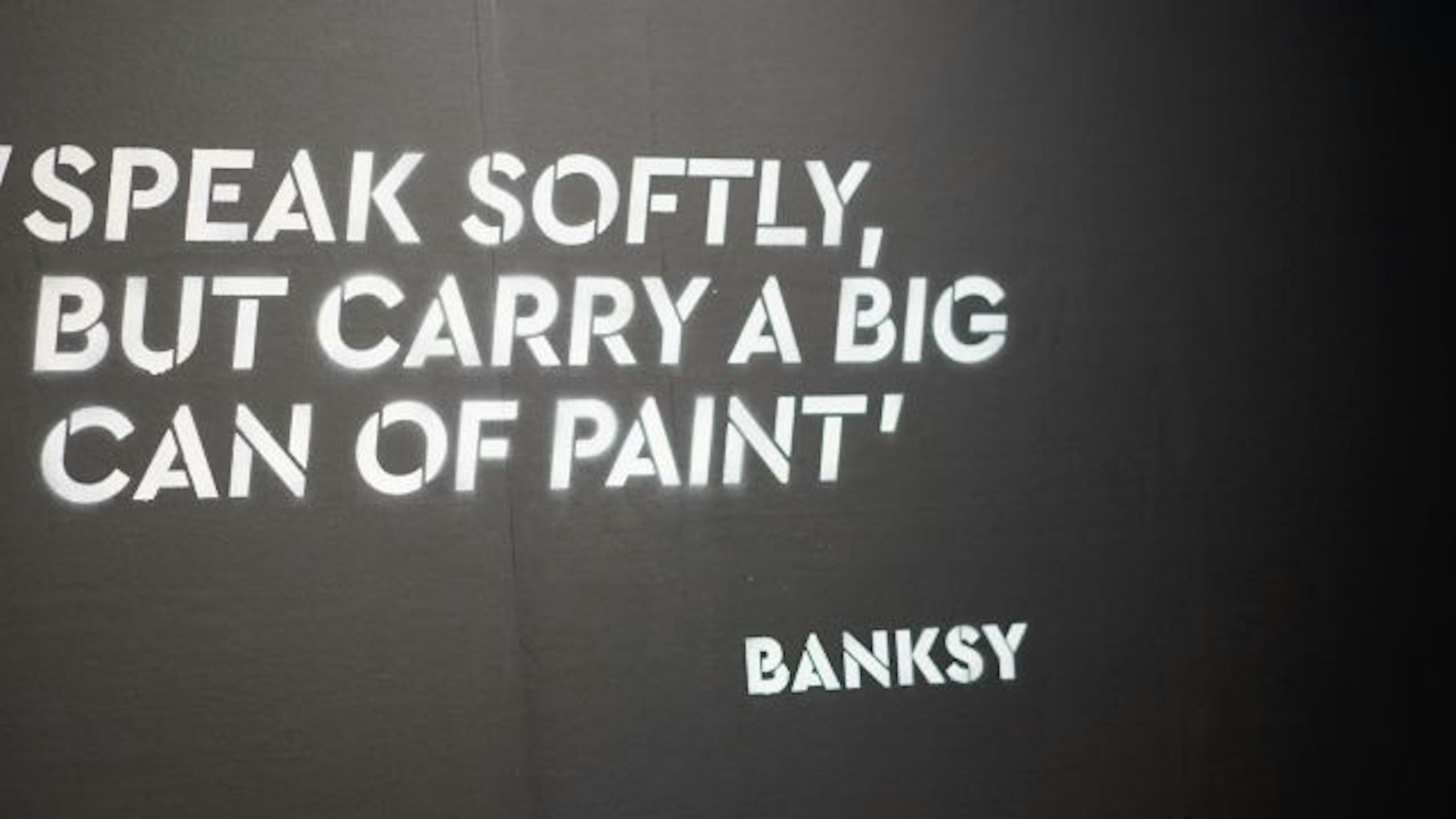 YOKOHAMA, JAPAN - MARCH 27: A Banksy quote is seen on the wall at the 'Banksy Genius or Vandal?' exhibition at Asobuild on March 27, 2020 in Yokohama, Japan. The exhibition, open amid the COVID-19 situation in the Tokyo suburb since its opening on March 15, 2020, will close for the coming weekend responding to the stay-at-home request ordered by Kanagawa and neighboring Tokyo Metropolitan governments this week. (Photo by