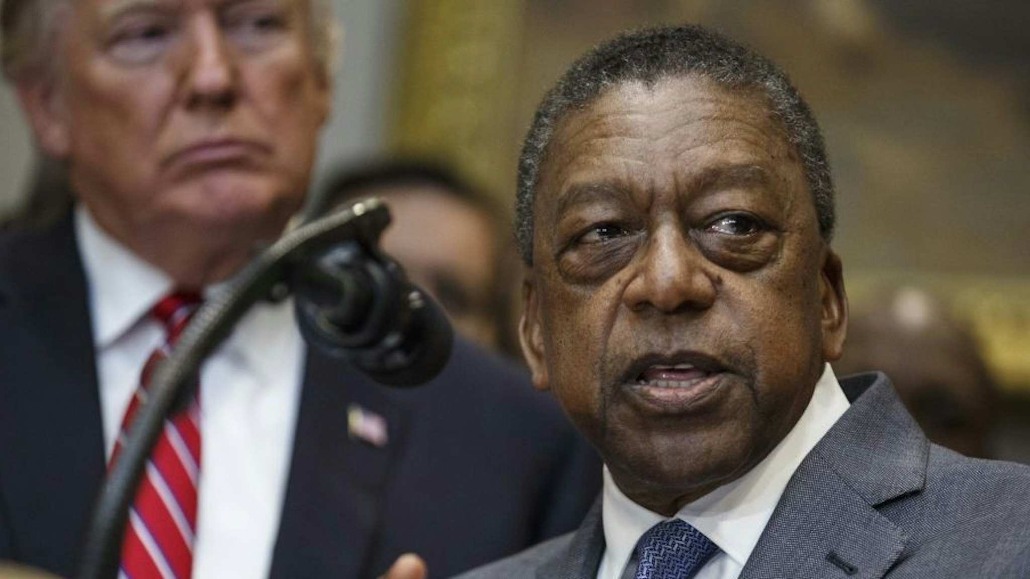 Robert Johnson, founder of Rlj Cos. and co-founder of Black Entertainment Television (BET), speaks during an executive order signing in the Roosevelt Room of the White House in Washington, D.C., U.S., on Wednesday, Dec. 12, 2018. President Donald Trump signed an order to create a White House Opportunity and Revitalization Council, directing federal agencies to steer spending toward certain distressed communities across the country called opportunity zone. Photographer: