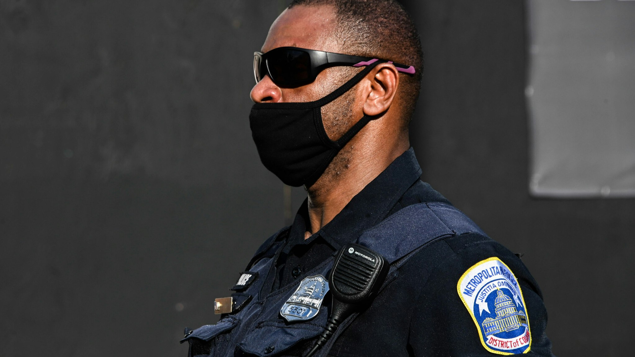 WASHINGTON, UNITED STATES - 2020/06/23: A police officer stands on guard at the Black Lives Matter Plaza during the demonstration. Tensions were high after Black Lives Matter protesters worked to remove the Andrew Jackson statue.
