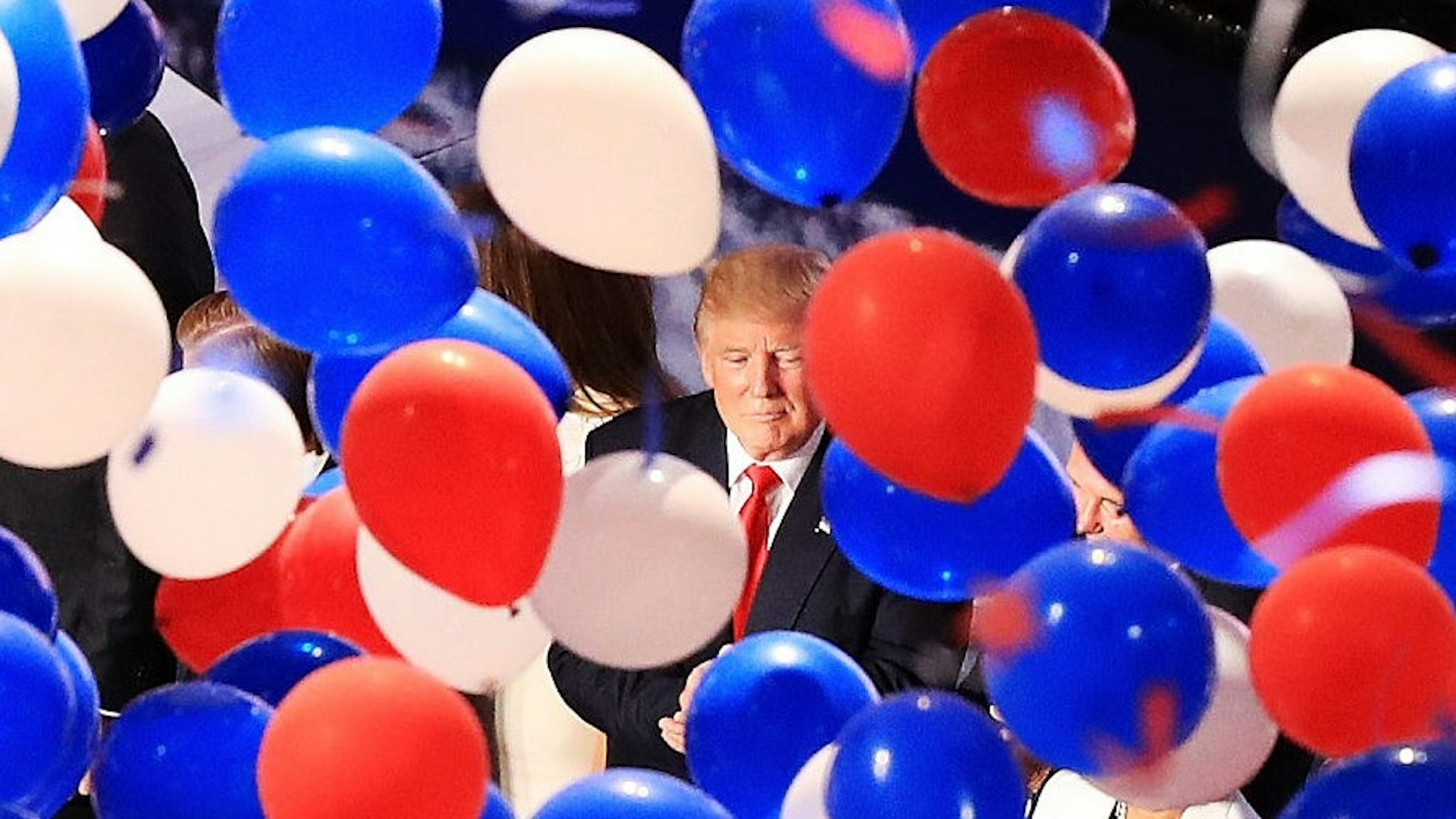 CLEVELAND, OH - JULY 21: Republican presidential candidate Donald Trump and his family acknowledge the crowd as balloons fall on the fourth day of the Republican National Convention on July 21, 2016 at the Quicken Loans Arena in Cleveland, Ohio. Republican presidential candidate Donald Trump received the number of votes needed to secure the party's nomination. An estimated 50,000 people are expected in Cleveland, including hundreds of protesters and members of the media. The four-day Republican National Convention kicked off on July 18. (Photo by