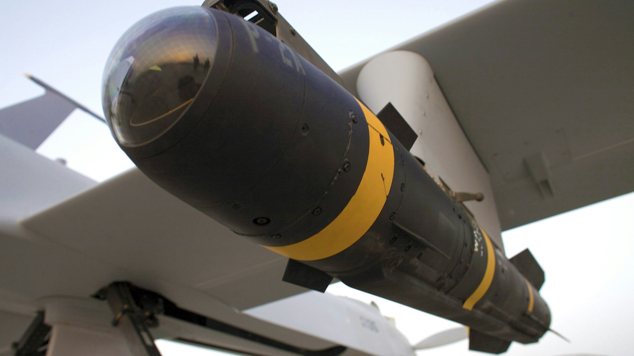 A Hellfire missile resting in the weapons bay of a US Air Force Predator drone aircraft. | Location: Kandahar Airfield, Kandahar, Afghanistan.
