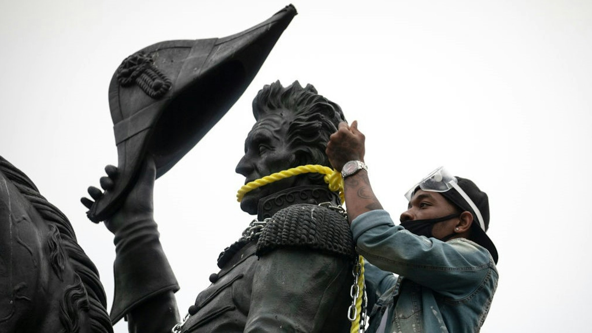 WASHINGTON, DC - JUNE 22: Protesters attempt to pull down the statue of Andrew Jackson in Lafayette Square near the White House on June 22, 2020 in Washington, DC. Protests continue around the country over the deaths of African Americans while in police custody. (Photo by