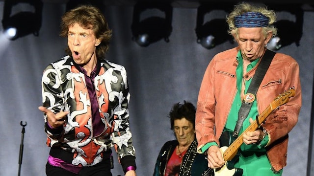 TOPSHOT - (L/R): British musicians Mick Jagger, Ronnie Wood and Keith Richards of The Rolling Stones perform during a concert at The Velodrome Stadium in Marseille on June 26, 2018, as part of their 'No Filter' tour. (Photo by Boris HORVAT / AFP) (Photo credit should read