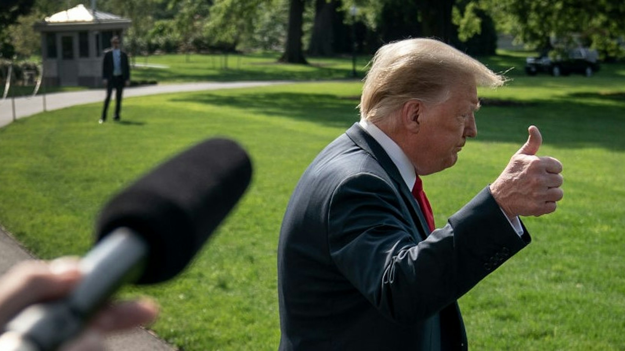WASHINGTON, DC - JUNE 23: U.S. President Donald Trump speaks to reporters before boarding Marine One on the South Lawn of the White House on June 23, 2020 in Washington, DC. Trump is traveling to Arizona where he will tour border-wall-construction operations in Yuma, later speaking to a conservative advocacy group in Phoenix. (Photo by